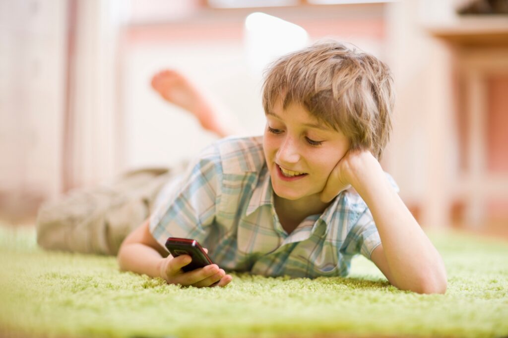 Boy writing a sms